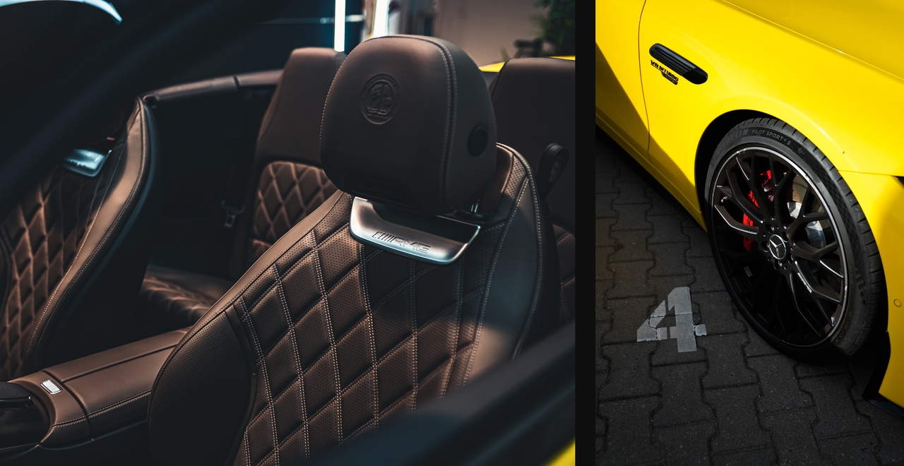 Pikowane skórzane fotele AMG w Mercedesie i zbliżenie sportowego koła z czerwonymi zaciskami hamulców